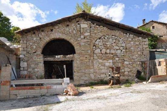 Imatge d'una de les edificacions auxiliars de la casa